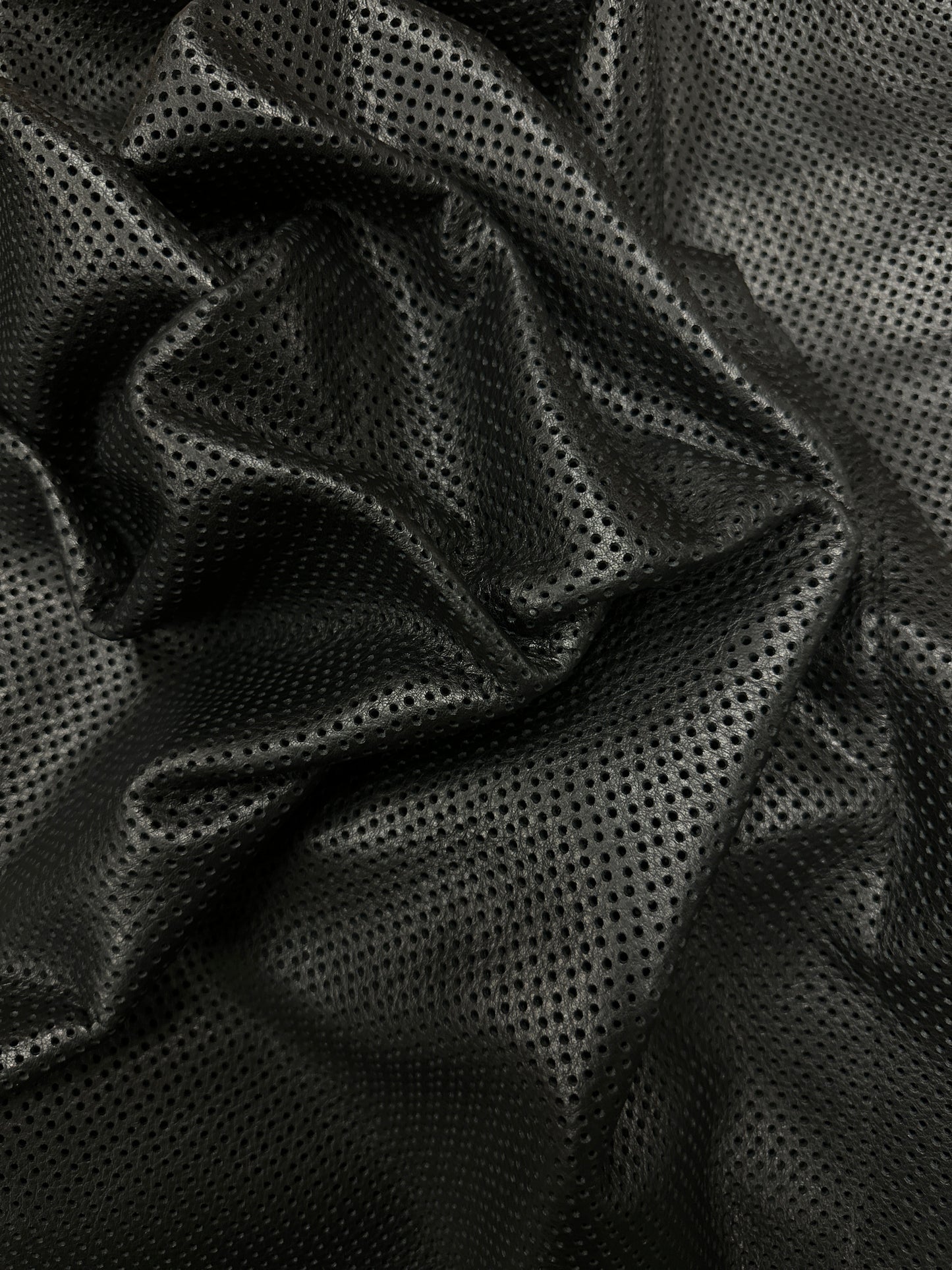 Black Perforated Garment Leather in Action